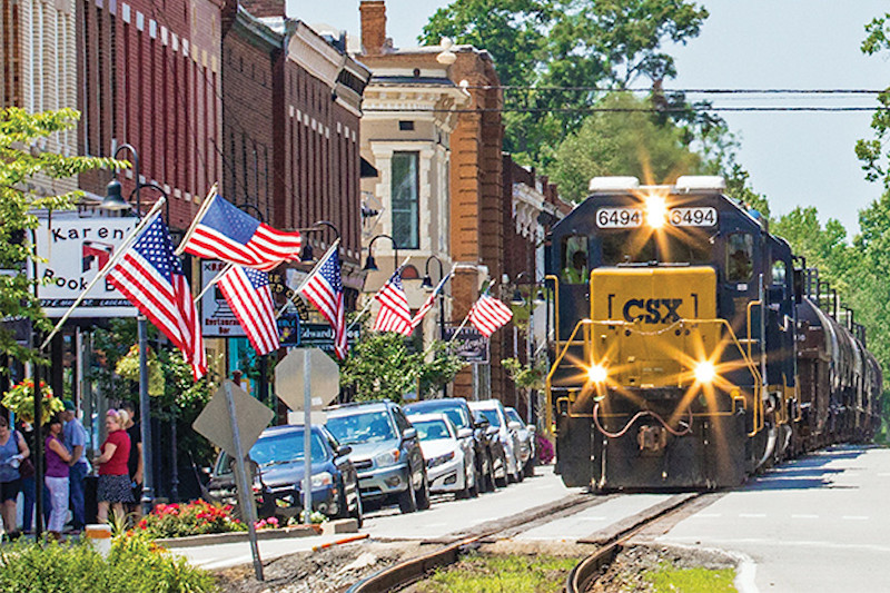 Train running down Main Street in Oldham County, KY